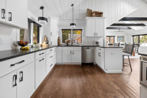Lake Sunapee Lake House Whole Home Remodel Kitchen with white cabinets