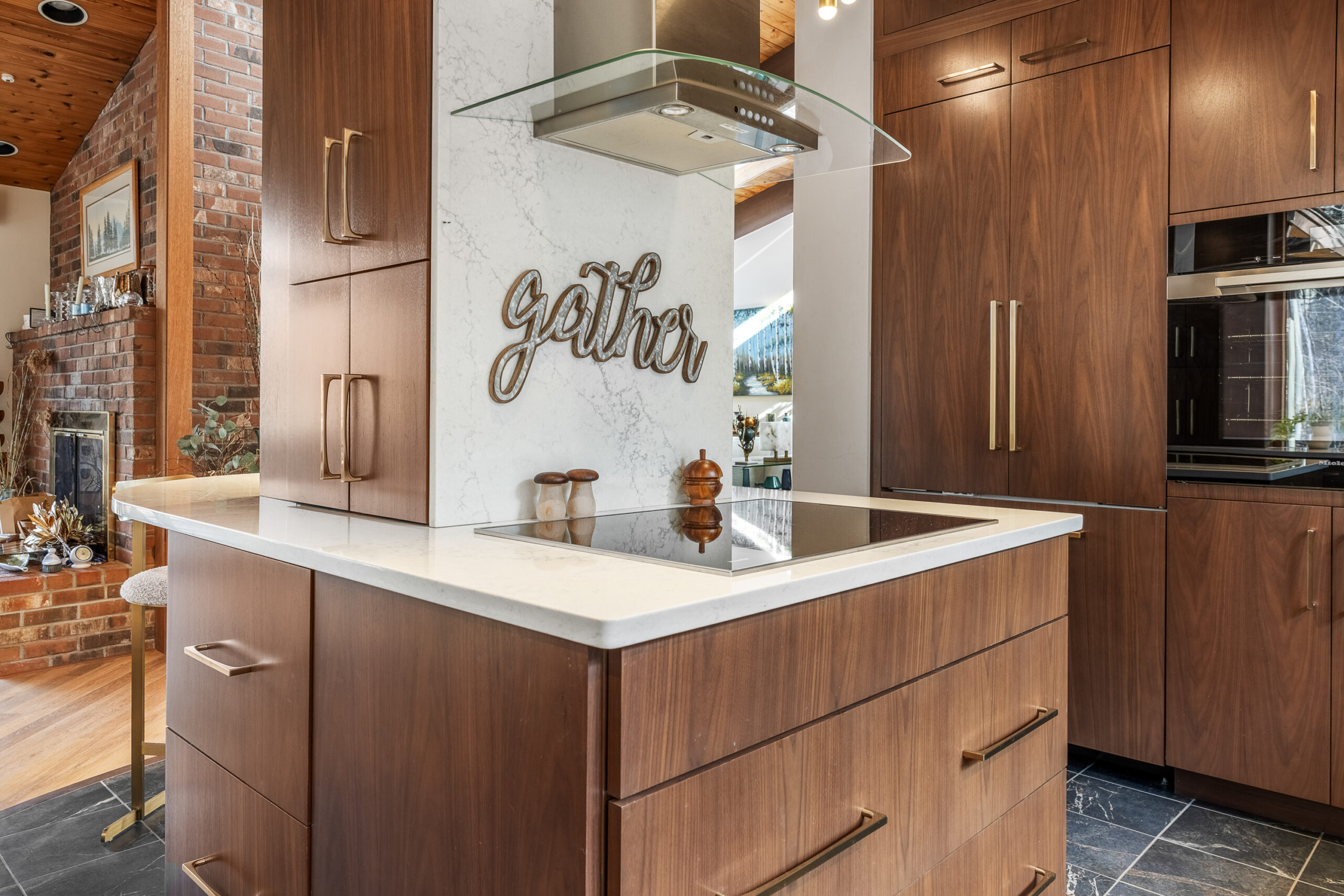 NH Kitchen remodel with stove top in center of kitchen and vent overhead