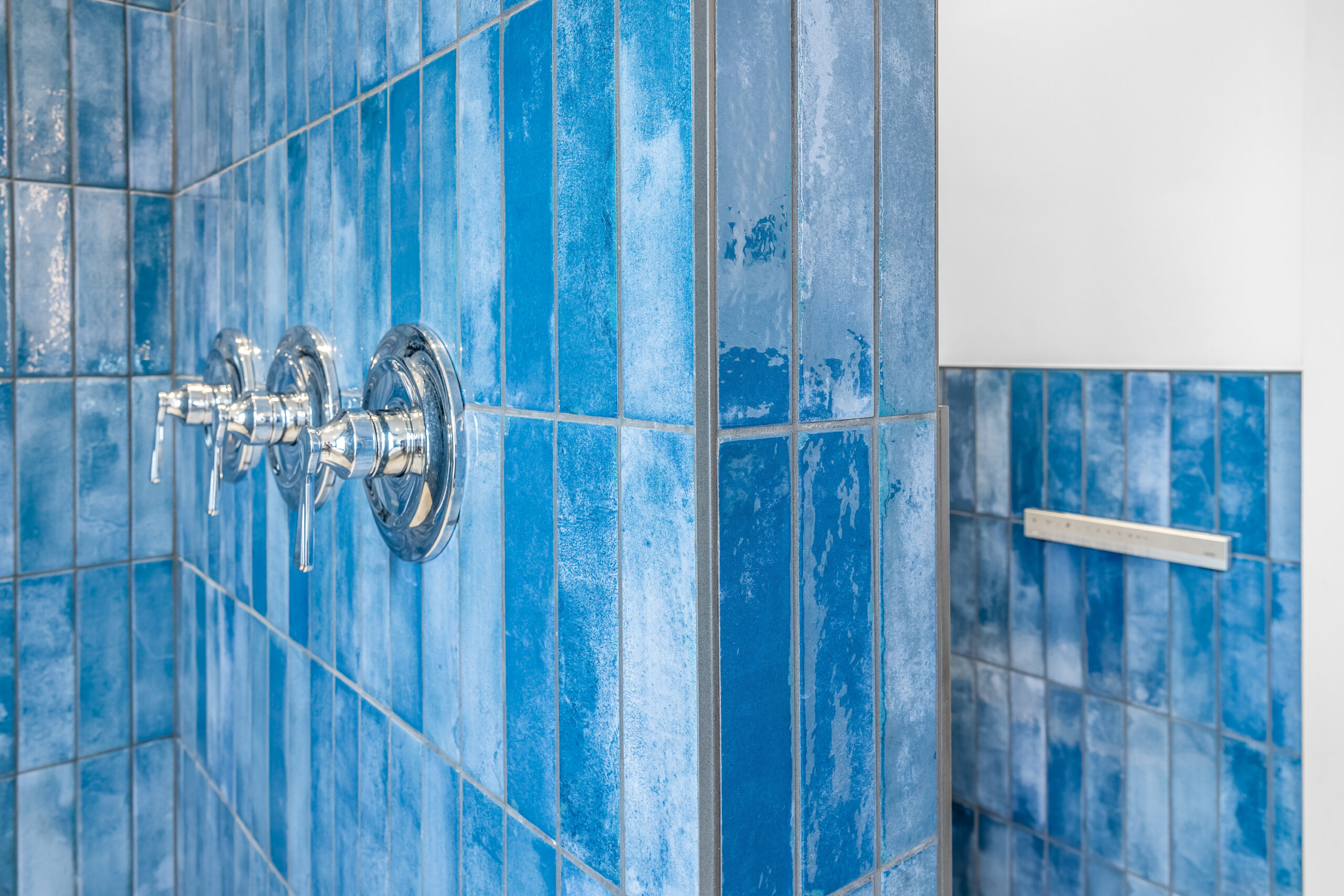 Blue bathroom tile grout details