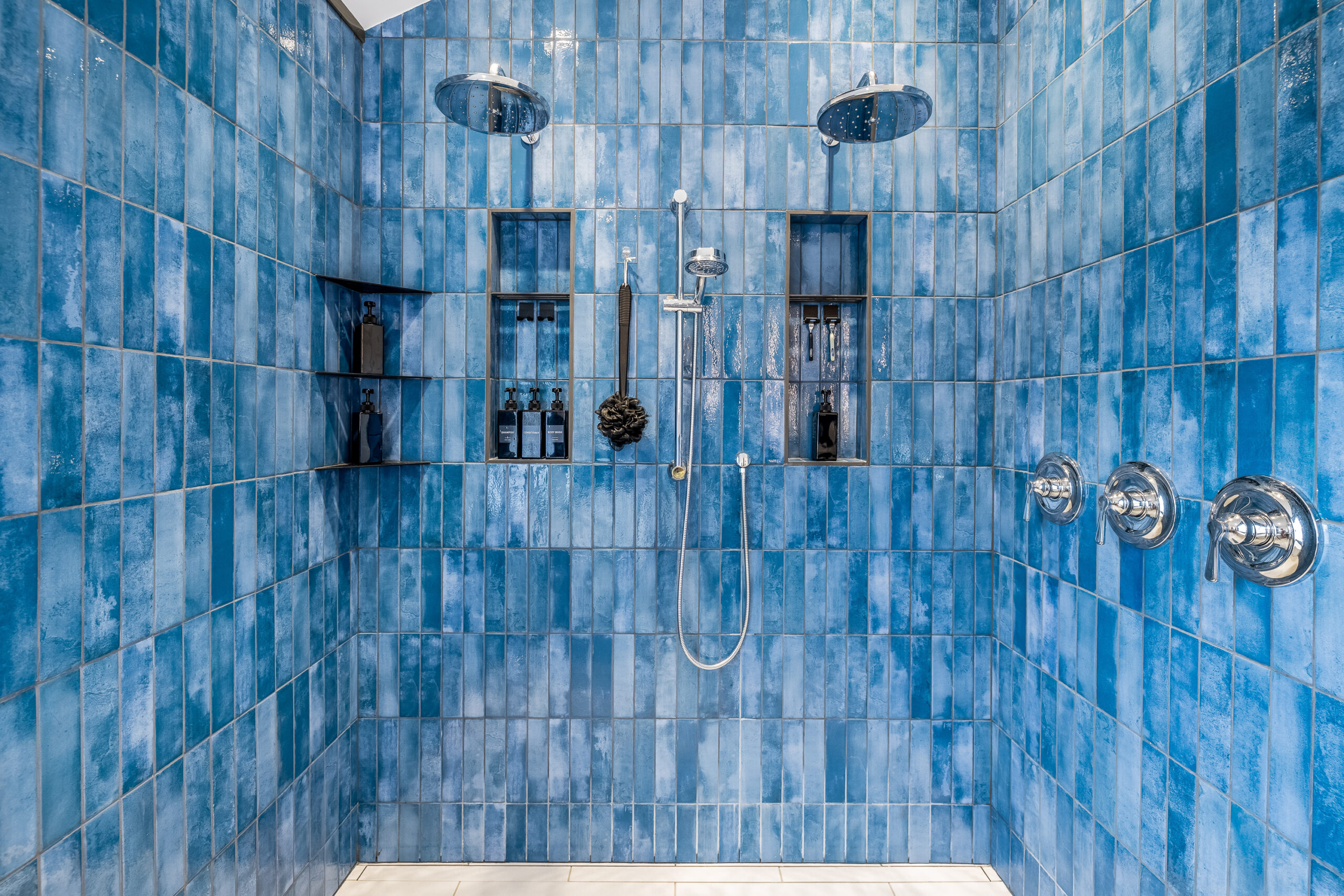New London NH bath remodel with blue tile shower with two rain heads