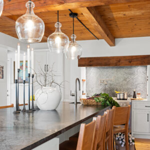 hanover kitchen remodel island with dark counter top and 4 glass pendants