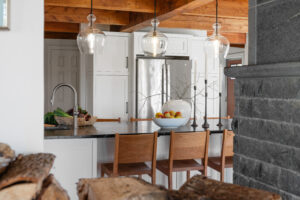 kitchen renovation with cabinets encasing fridge